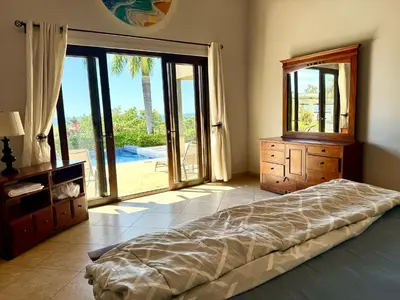 a bedroom with a bed and a dresser and a mirror at Villas with breathtaking seaview in Marbella