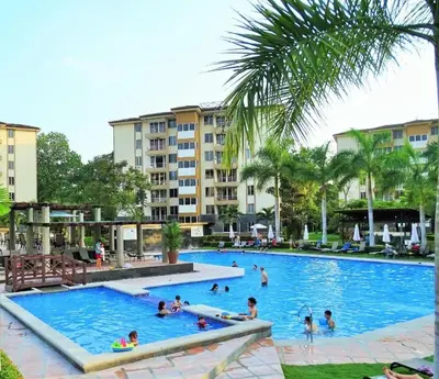 a group of people swimming in a swimming pool at Beautiful Jaco Apartment CL 1-23 - Just a short walking distance to the beach in Jacó