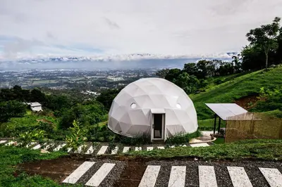 a white dome tent on top of a hill at Domo Mágico en las Alturas, EL SOL in San José