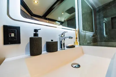 a bathroom with a sink and a mirror at Domo Mágico en las Alturas, EL SOL in San José