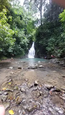 a waterfall in the middle of a river with rocks at Private room in nature in Coronado