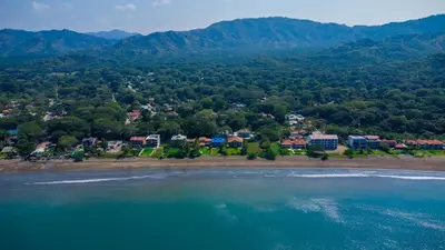 an aerial view of a resort on the beach at Pequeno Paraiso - New Studio, 10min walk to Potrero beach, tranquil - Unit D in Potrero