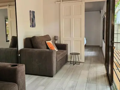 a living room with a couch and a table at Mystica Playa Avellanas in Playa Avellana