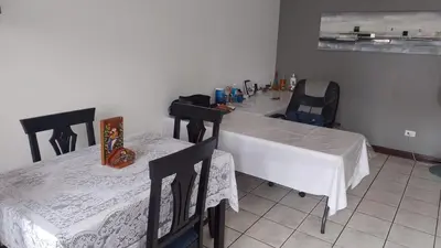 a room with two tables and two chairs at Rincón Metropolitano in San José