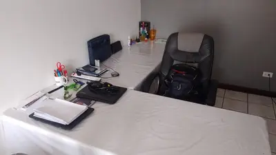 a white desk with a computer on top of it at Rincón Metropolitano in San José