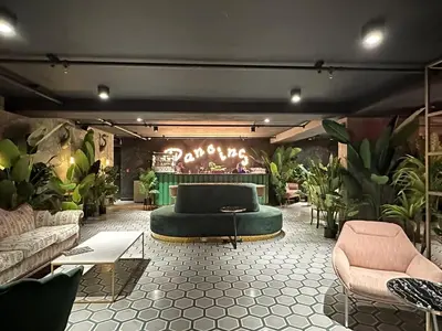 a living room with a couch and some plants at Sabana Chic in Hatillo
