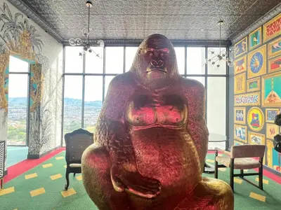 a statue of a person sitting in a room at Sabana Chic in Hatillo