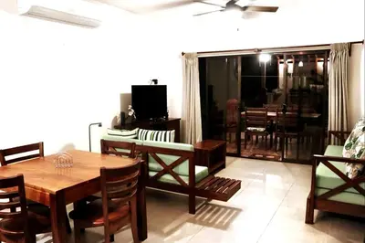 a living room with a wooden table and a dining room at Casa Lucas in Villarreal