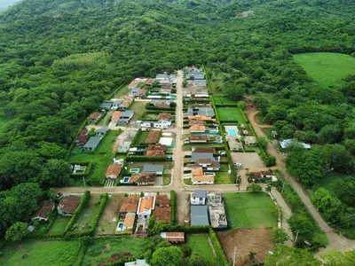 an aerial view of a village in the middle of a forest at Casa Lucas in Villarreal