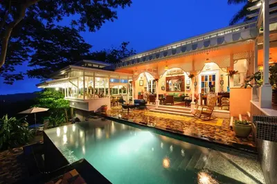 a house with a swimming pool in front of it at Villa Turrubares in San Pablo