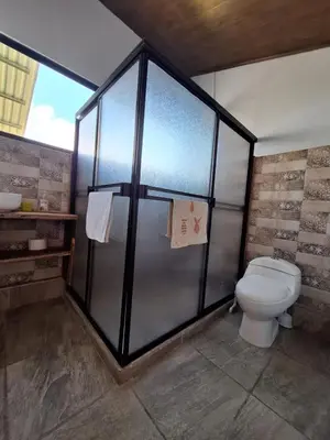 a bathroom with a shower with a toilet in it at Mountain & sunset view Villa, Monteverde in Monteverde Costa Rica