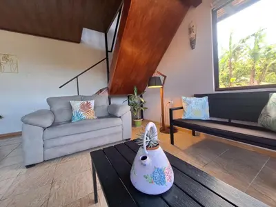 a living room with a couch and a table at Mountain & sunset view Villa, Monteverde in Monteverde Costa Rica