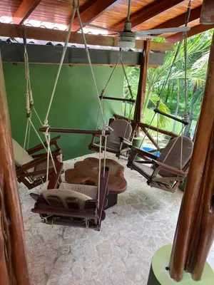 a group of chairs hanging from a ceiling at Casa Colibrí Playa Grande in Santa Cruz