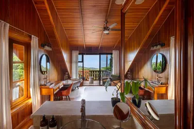 a kitchen with wooden walls and a ceiling at Hotel Belmar in Monteverde Costa Rica