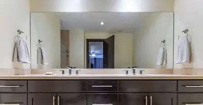 a bathroom with two sinks and a large mirror at Luxe, Playa del Coco, Pacific in Coco