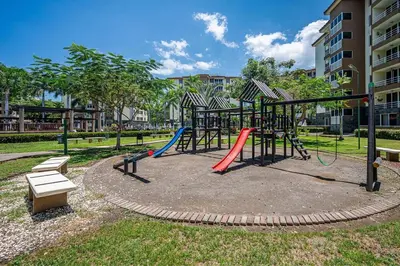 a park with a playground with a slide at 2-17 Jaco Beach Beautiful Costa Linda Condo in Jacó
