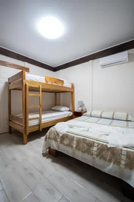 a bedroom with two bunk beds in a room at Bay Lodge in La Cruz