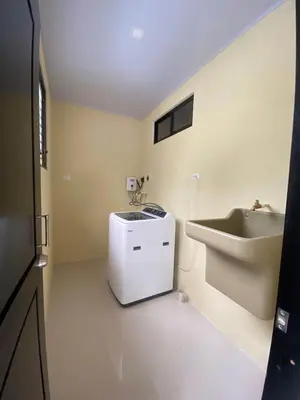 a bathroom with a sink and a toilet and a sink at Sarahs Villas in Parrita