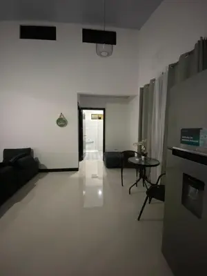 a living room with a couch and a table at Sarahs Villas in Parrita