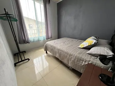 a small bedroom with a bed and a window at Bellavista Ceci A2 in San Ramón