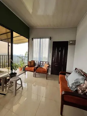 a living room with two couches and a balcony at Bellavista Ceci A2 in San Ramón