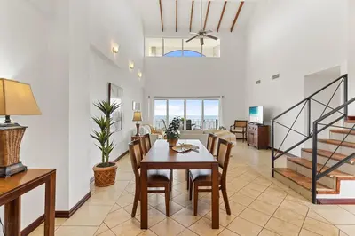 a dining room with a table and chairs at MPH Spacious Penthouse with Ocean Views in Tamarindo