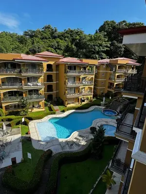 an aerial view of an apartment complex with a swimming pool at Pacific Sun Penthouse in Herradura