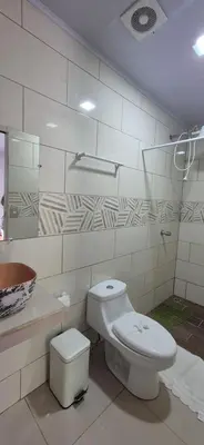 a bathroom with a toilet and a sink at House in the heart of La Fortuna in Fortuna
