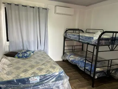 a room with two bunk beds and a window at Casa playa vacaciones in Santa Cruz