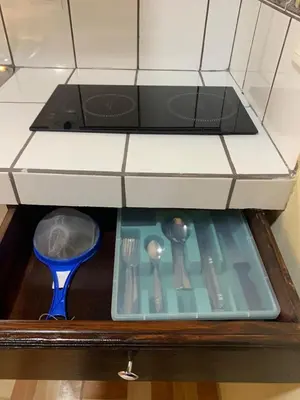 a drawer in a kitchen with utensils at Hospedaje Oropendola Nest in Bagaces