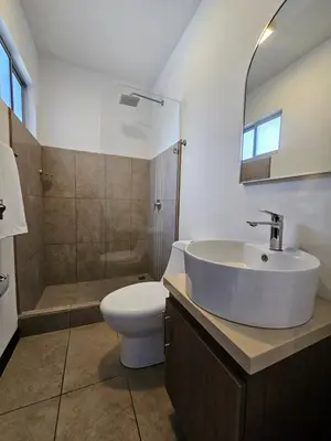 a bathroom with a sink and a toilet and a shower at Apartamento Boulevar Park in Heredia