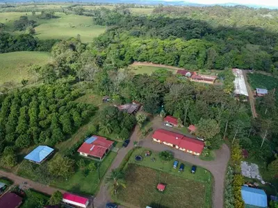 an aerial view of a farm with houses and trees at Hotel del Bosque in Río Cuarto