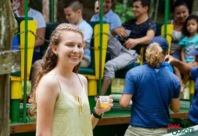 a young girl standing in front of a group of people at Hotel del Bosque in Río Cuarto