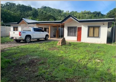 a white truck parked in front of a house at Casas Vacacionales Tambor Beach in Puntarenas