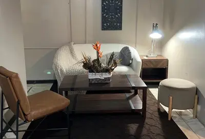 a living room with a coffee table and a couch at Apartamento Chic en la Montaña AC in Turrialba