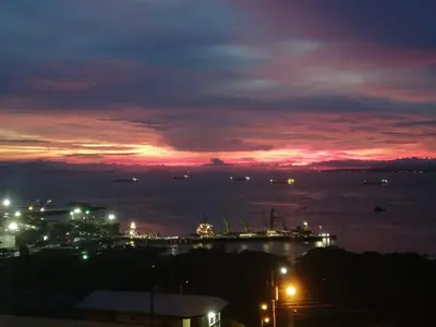 a view of a city at night with a sunset at Ocean-View Maryland House in Esparza