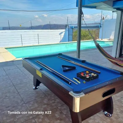 a pool table with cue balls on top of it at Ocean-View Maryland House in Esparza