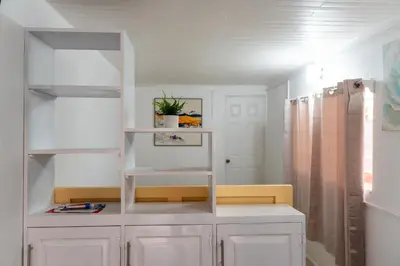 a room with a white shelf and a white cabinet at Nido del Parque, Zarcero in Zarcero