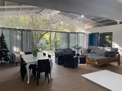 a living room with a couch and a table at Casa Guanabana in Nicoya