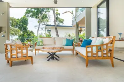 a living room with two chairs and a couch at Villa Serenidad in Uvita