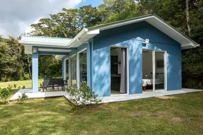 a blue tiny house in a yard at Casa Grano de Oro Cozy Home in Monteverde in Turín