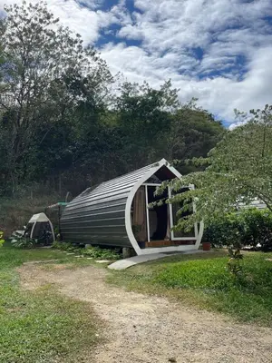 a small shed with a porch and a tent at Villas alice in Huacas