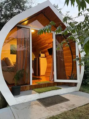 an outside view of a house with an open door at Villas alice in Huacas