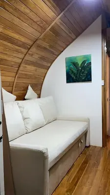 a bed in a room with a wooden ceiling at Villas alice in Huacas