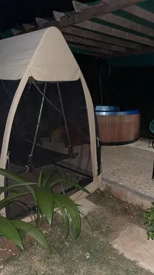 a black and white tent next to a plant at Villas alice in Huacas