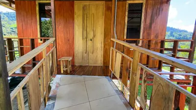 an inside view of a cabin with wooden walls at Digrú Spaa in Pejibaye