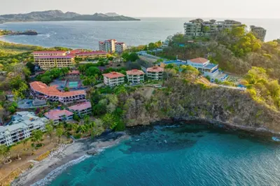 an aerial view of a resort near the ocean at Condominio Punta Plata in Playa Flamingo