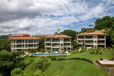a resort with a large yard with a pool at Condominio Punta Plata in Playa Flamingo