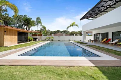 a swimming pool in the backyard of a house at Casa Corales Dreams 1 in Playa Flamingo