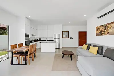 a living room with a couch and a table at Casa Corales Dreams 1 in Playa Flamingo
